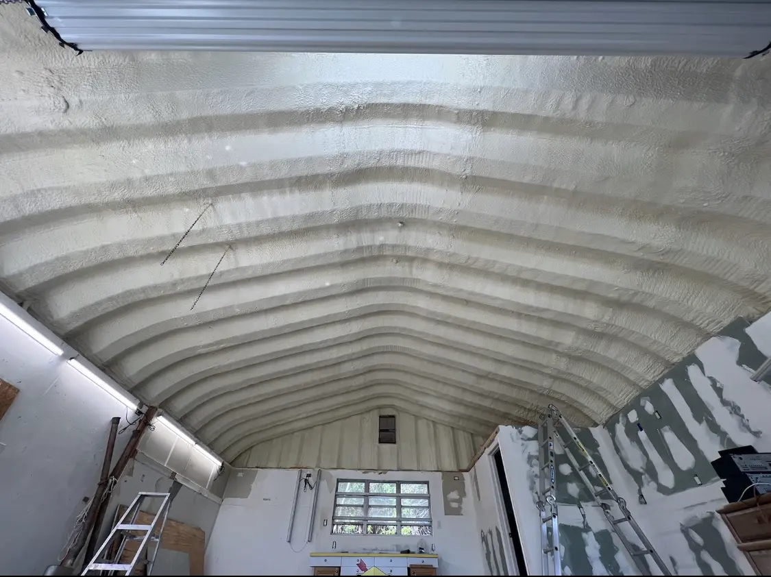 Spray polyurethane foam applied to the underside of a metal roof deck in Ardmore